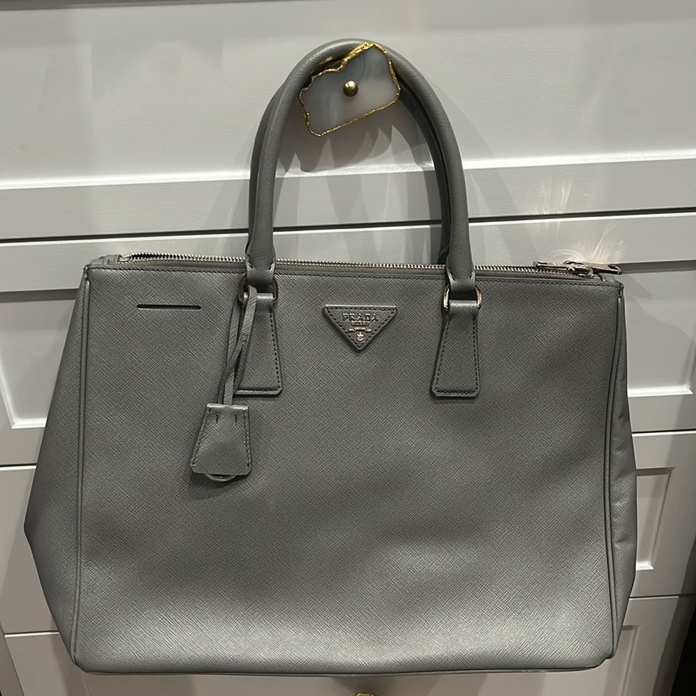 Grey Prada tote bag with 3 compartments, 2 zipper sections. Gently used.